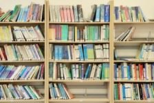 Scene of a library with books on a shelf